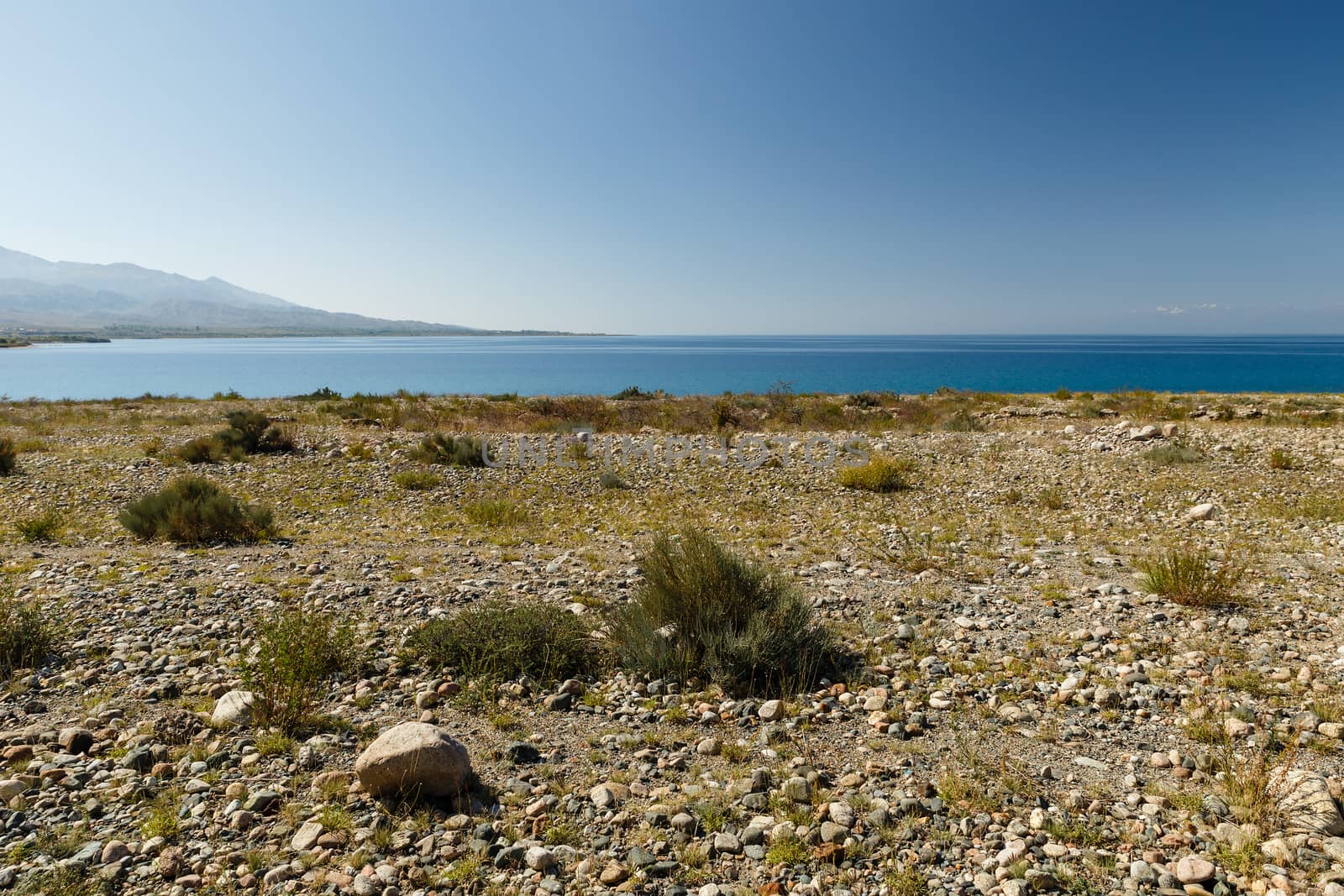 Lake Issyk-kul, the largest lake in Kyrgyzstan, pebbles on the south shore of the lake