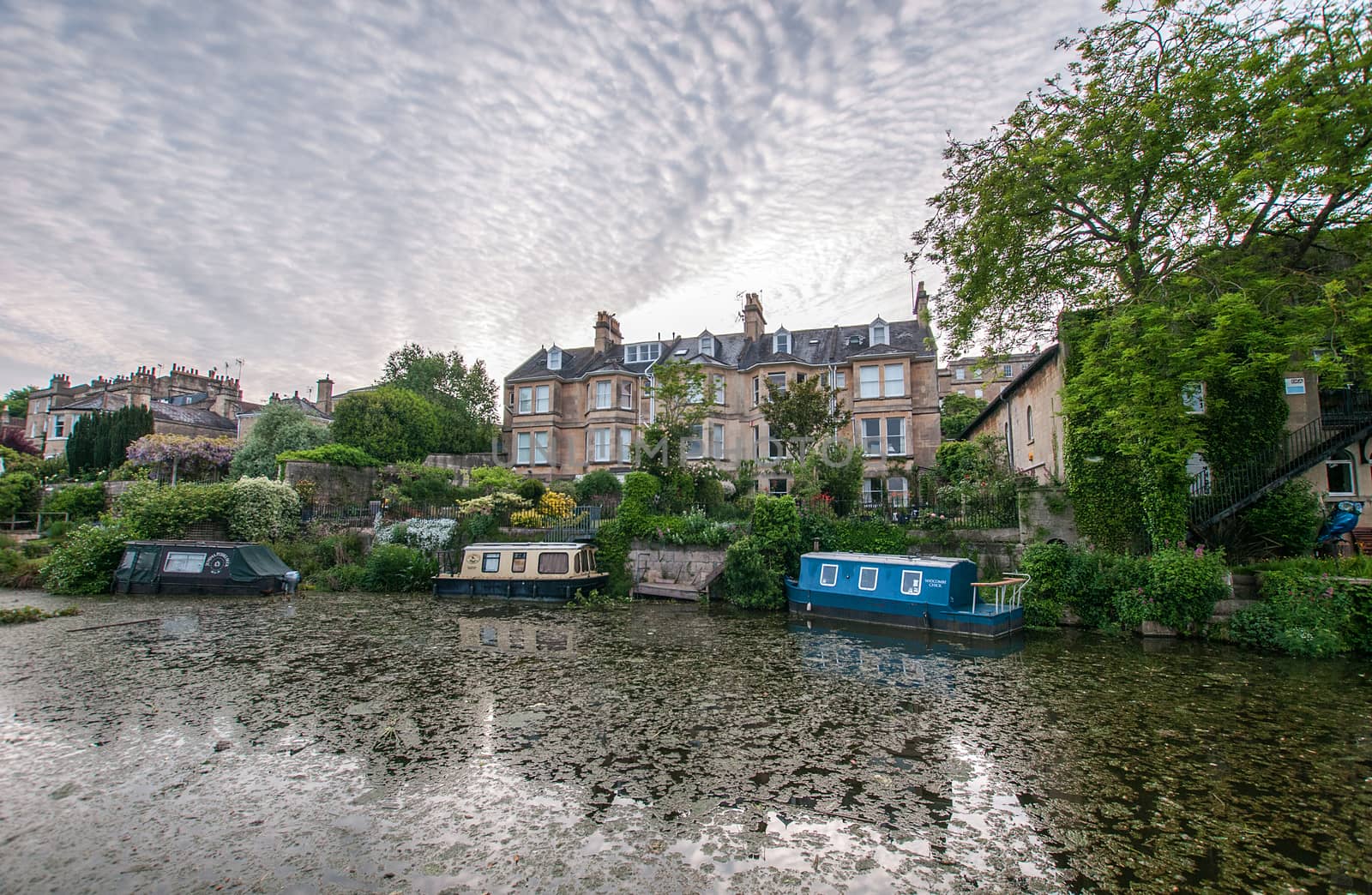 the kennet and avon canal early in the morning against a mackerel sky by sirspread