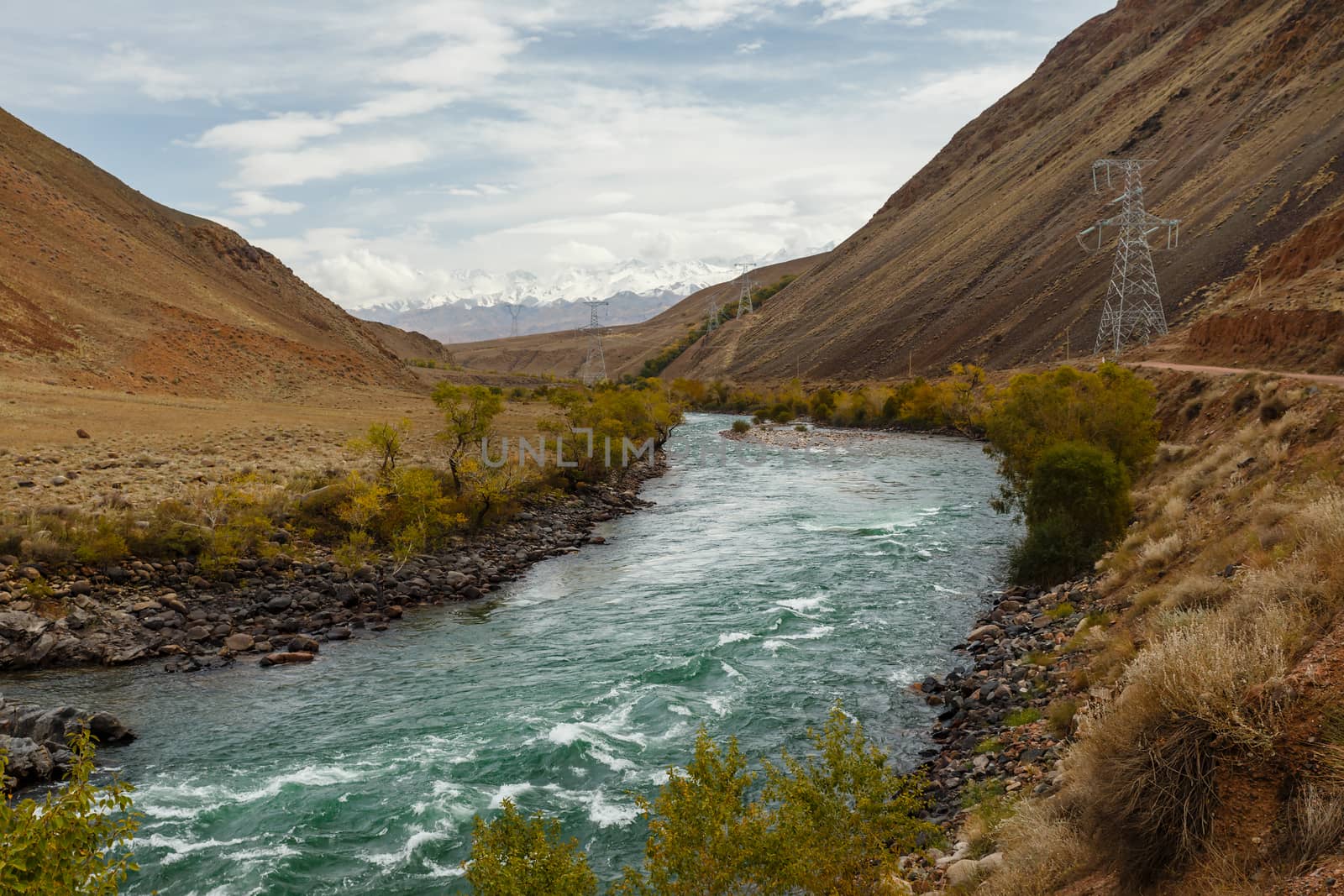 Kokemeren river, Aral, Jumgal District, Kyrgyzstan, road and power lines in the gorge