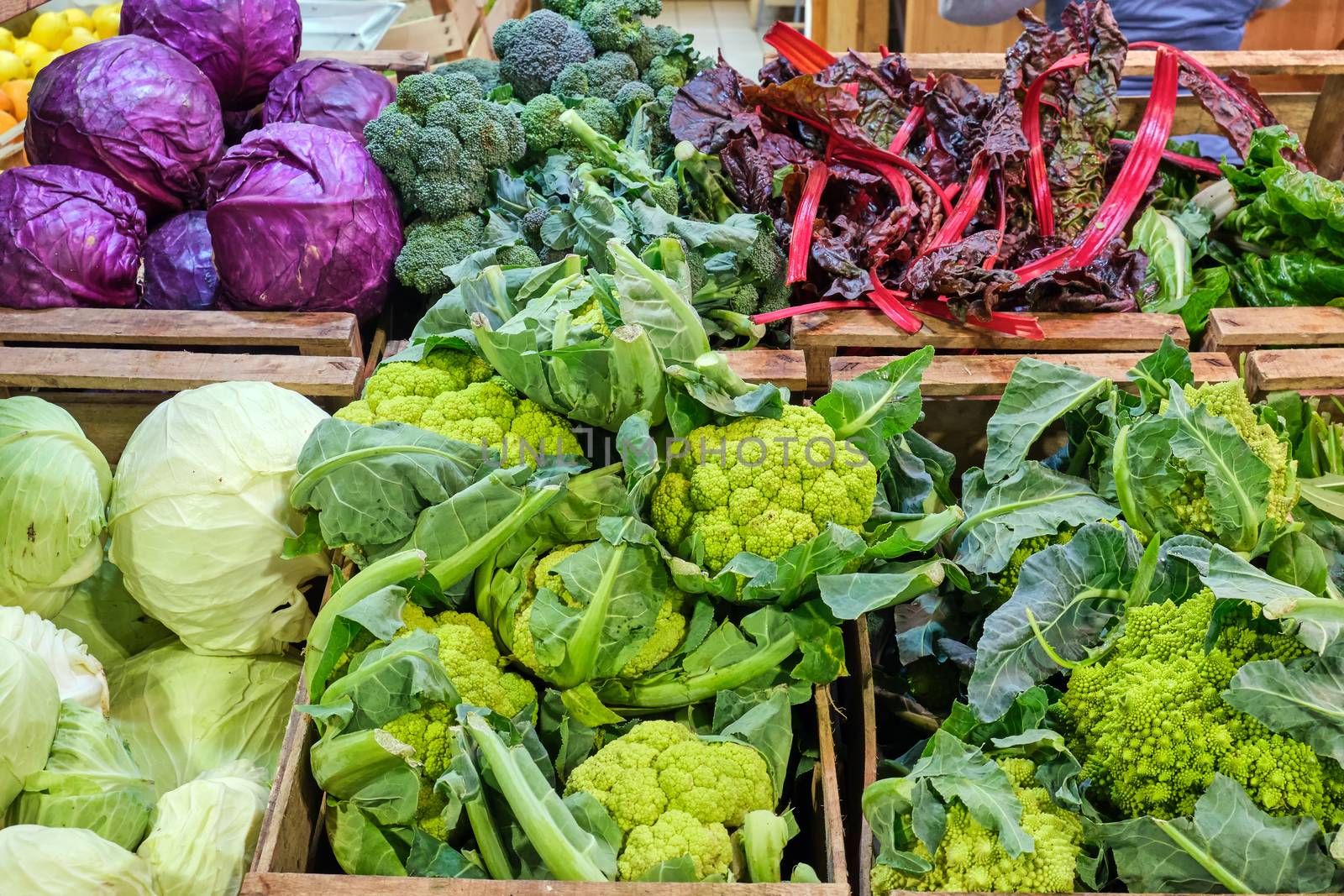 Cabbage and broccoli for sale at a market