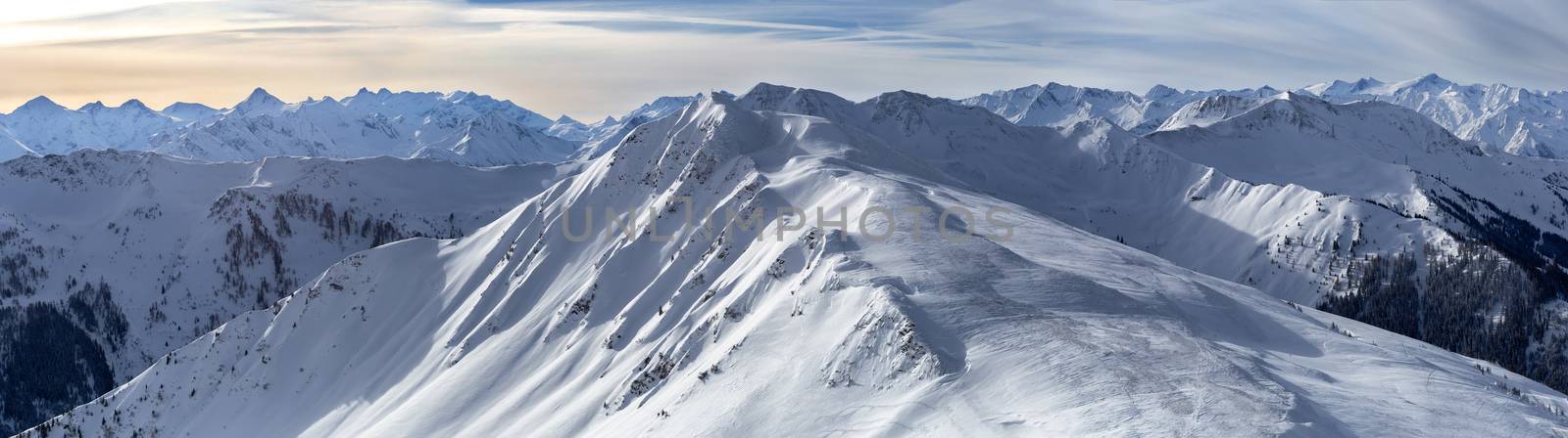 Panoramic view of beautiful winter wonderland mountain scenery in the Alps