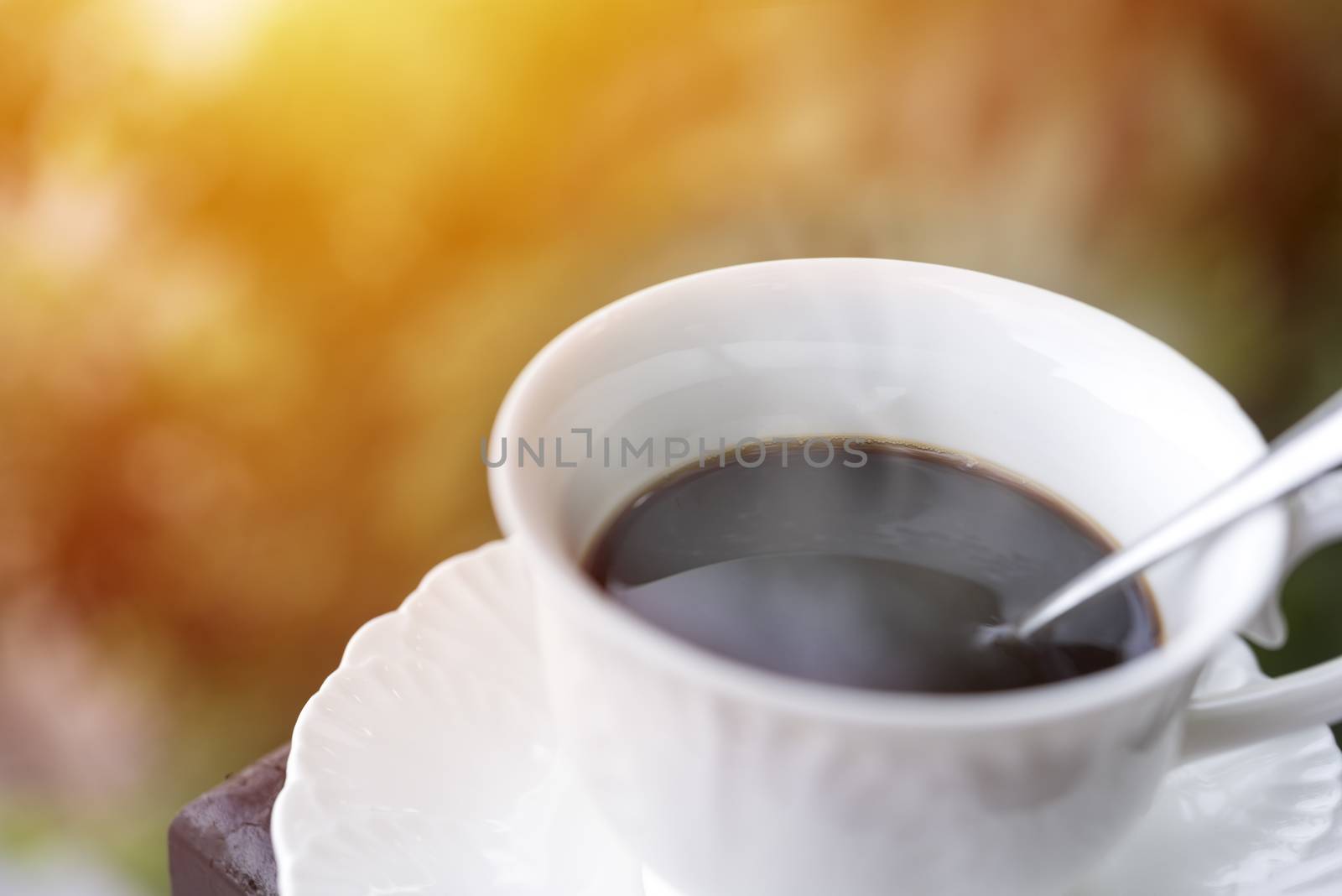 Morning coffee at balcony with sun rise and sun ray soft focus selective coffee