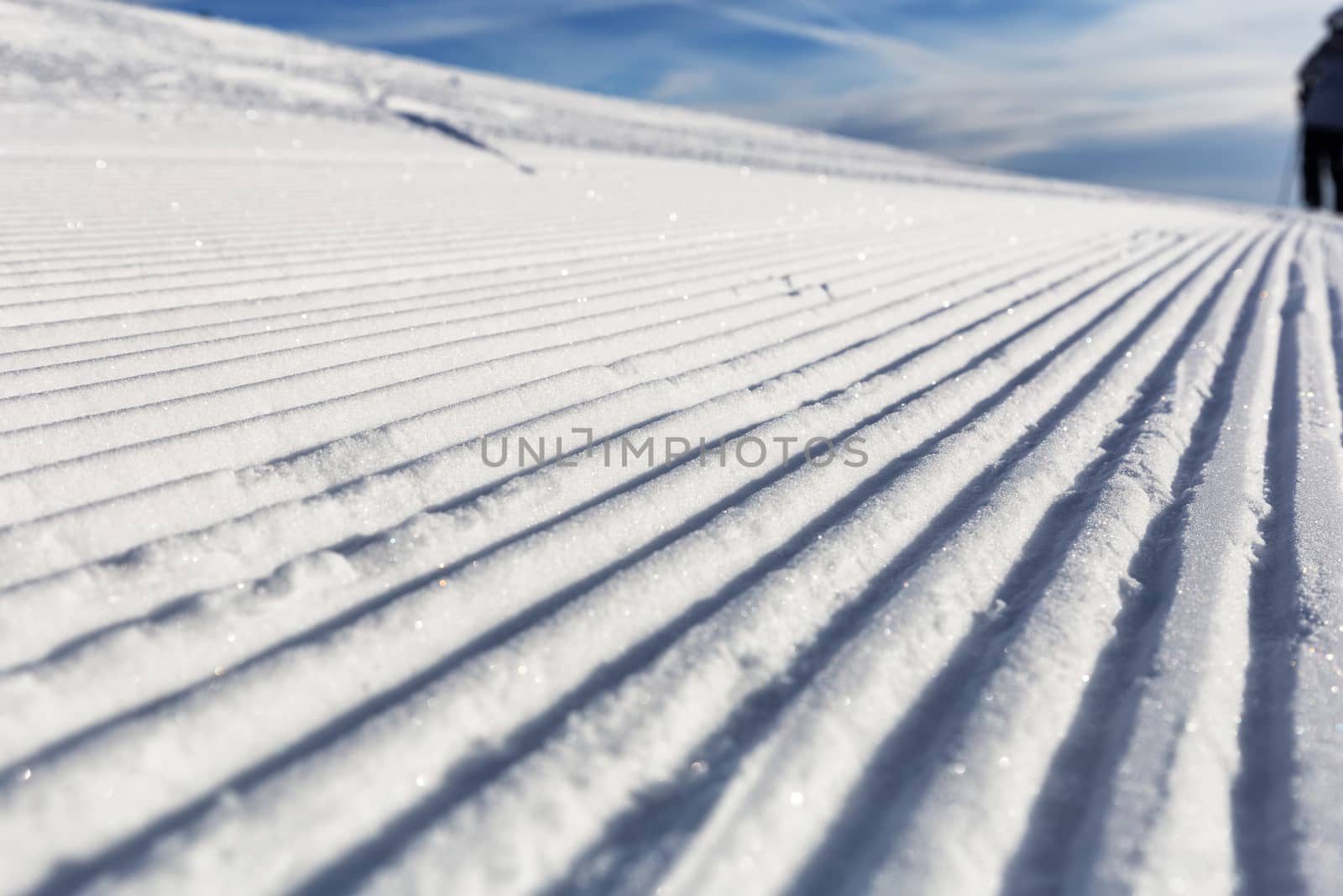 Close-up groomed snow at ski resort, slope banner background tex by necro79