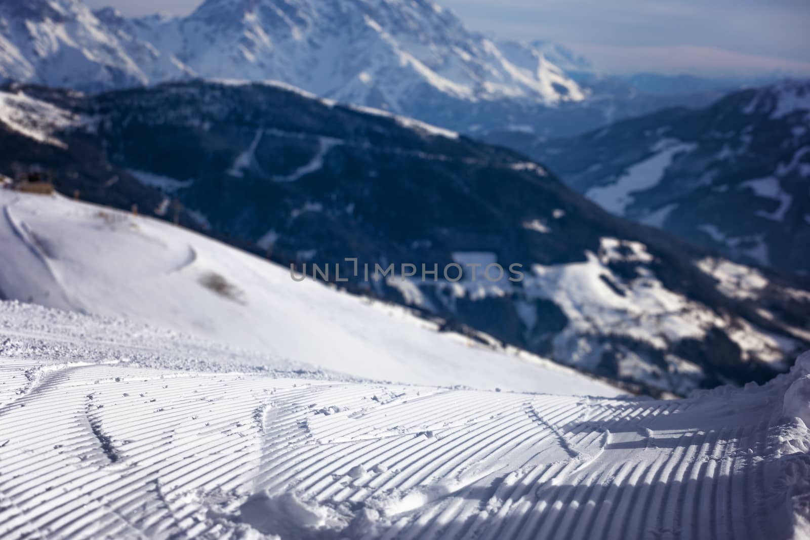 Close-up groomed snow at ski resort, slope banner background texture