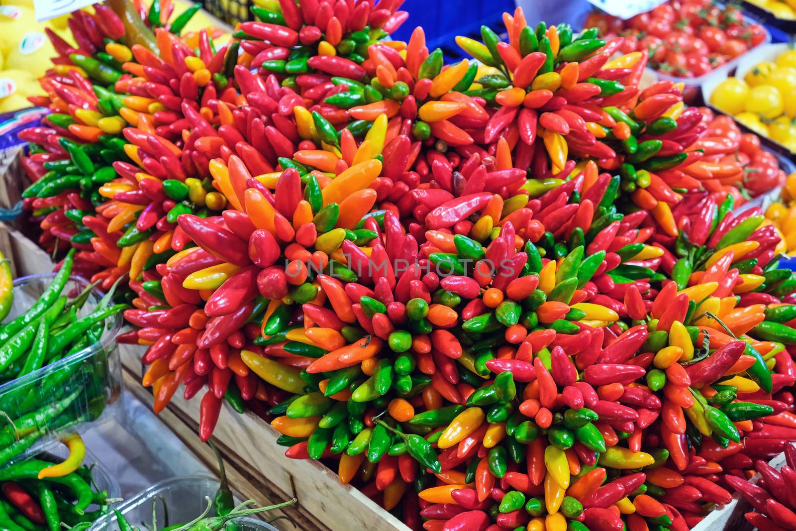 Colorful chili peppers for sale at a market