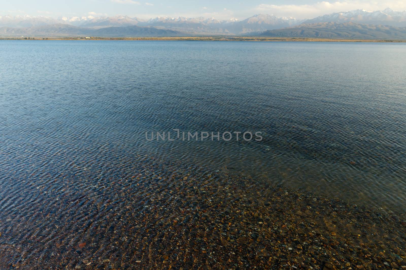 clear water in Issyk-Kul Lake, stones at the bottom of the lake, Kyrgyzstan.