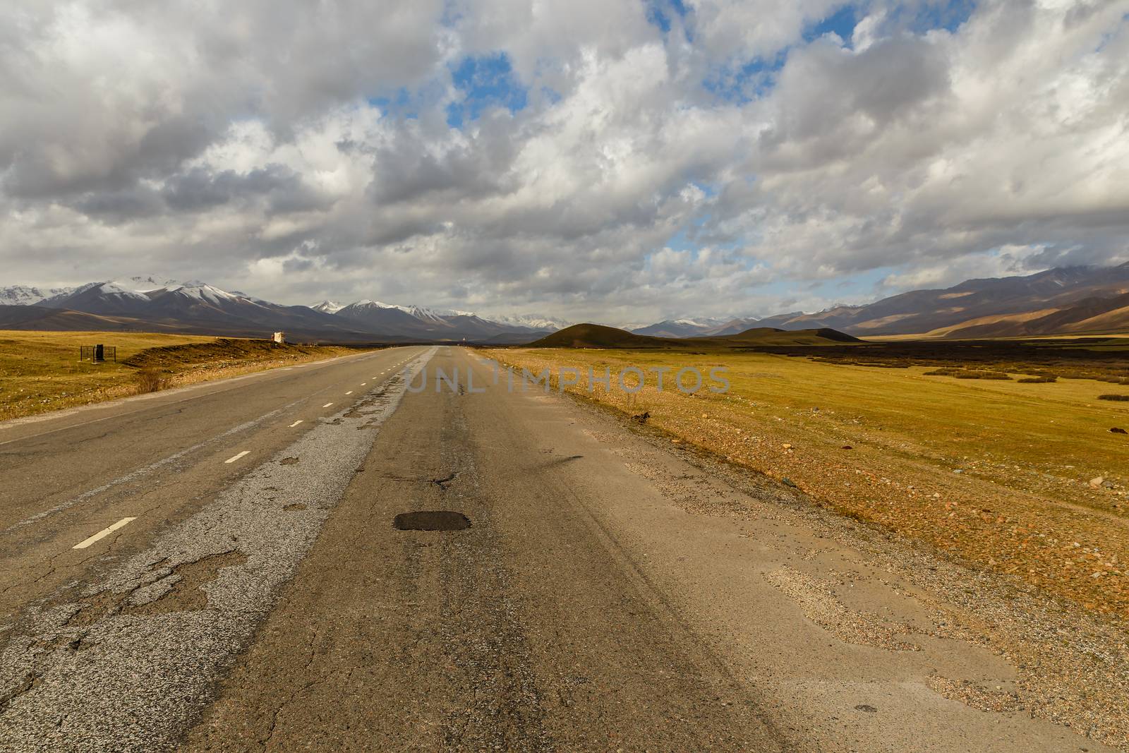 asphalt road, Bishkek-Osh highway, Suusamyr valley Kyrgyzstan
