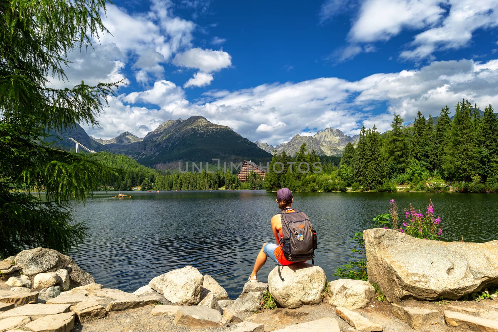 Women relaxing at mountain lake Strbske pleso in National Park H by necro79