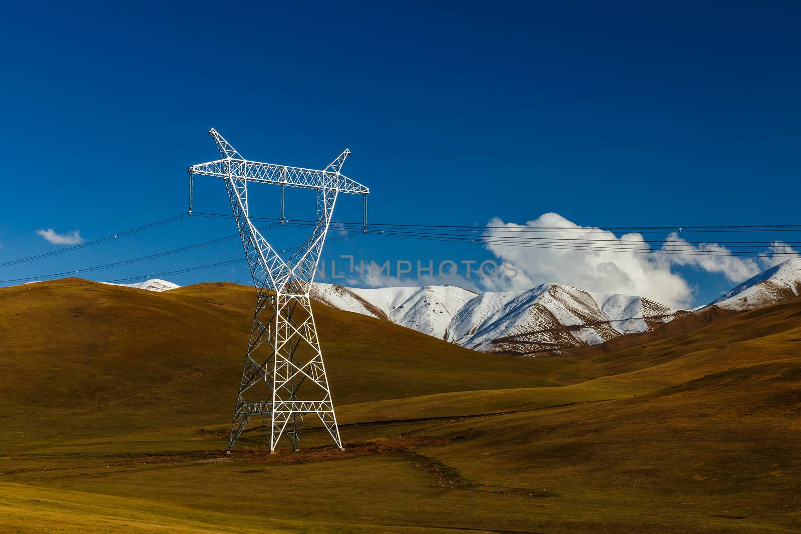 pylons of high-voltage power lines in the mountains by Mieszko9