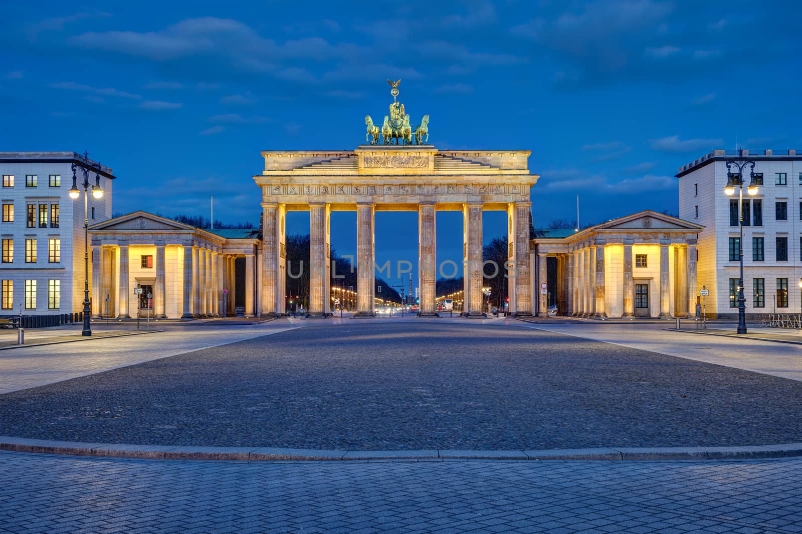 Panorama of the illuminated Brandenburger Tor in Berlin at dawn with no people