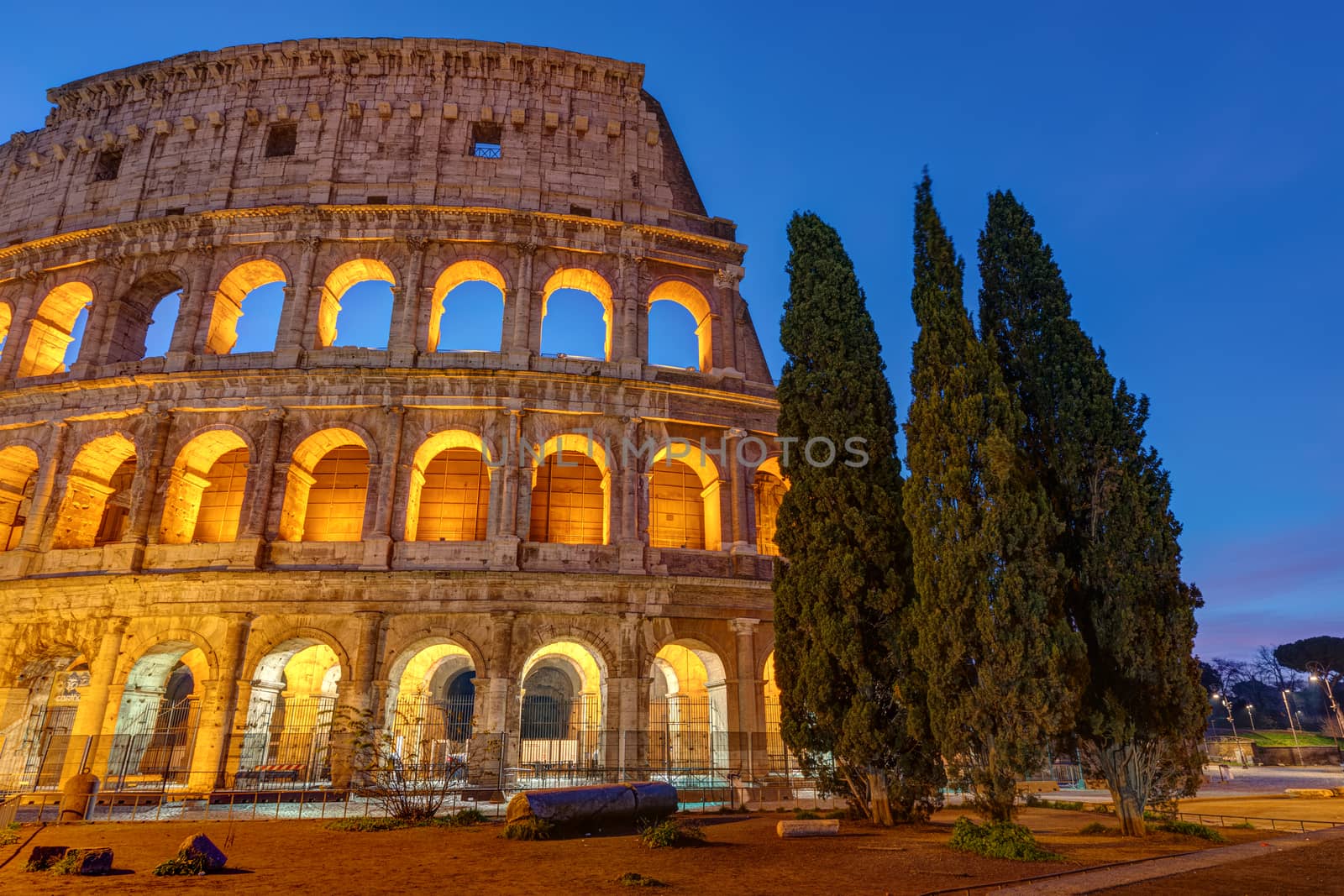 The illuminated Colosseum in Rome at twilight