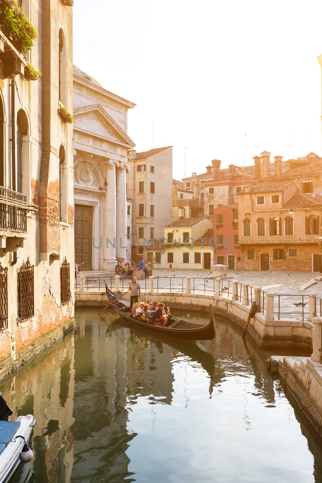 Italy, Venice - July 22, 2017: Gondola ride in small canal by necro79