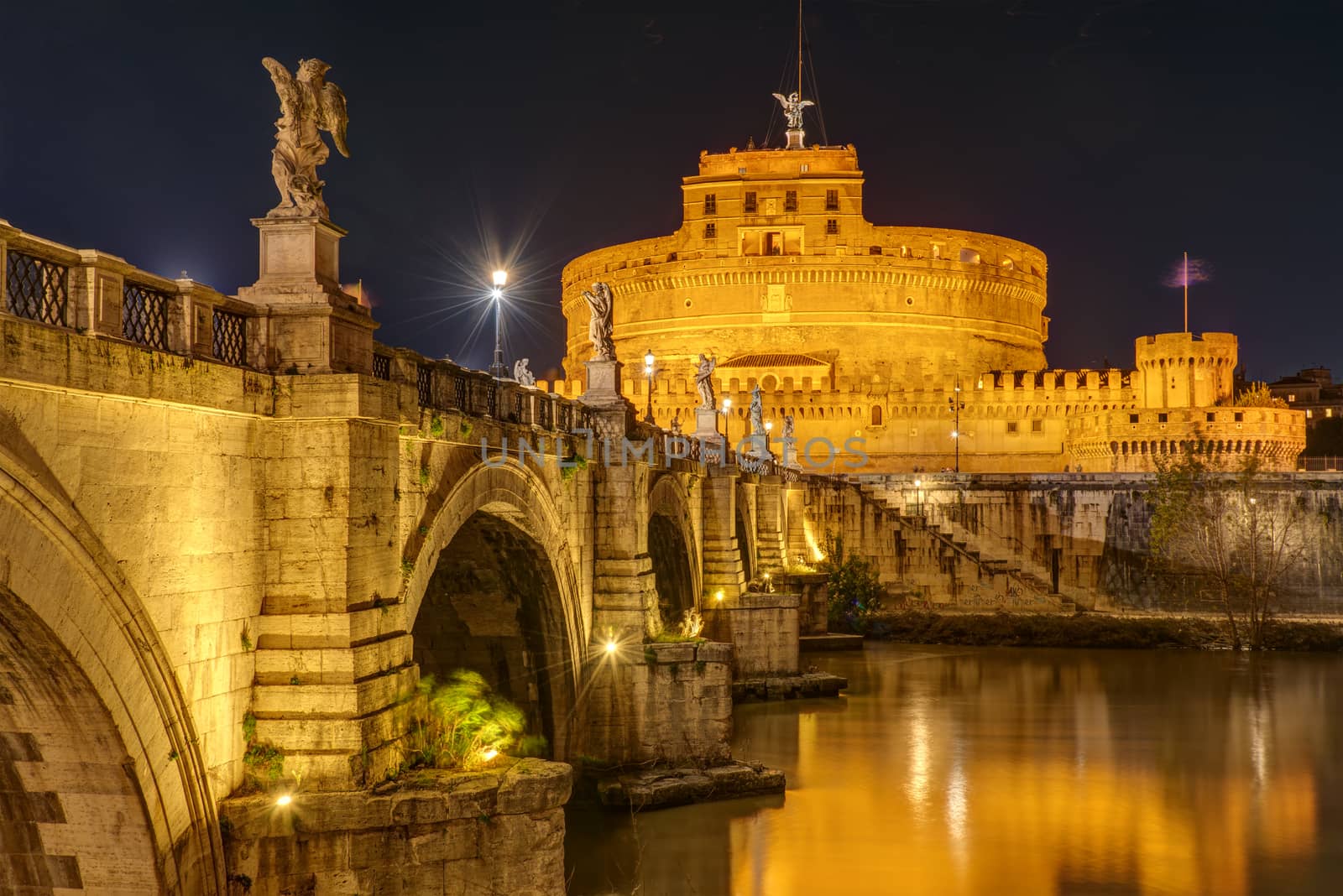 The famous Castel Sant Angelo and the Sant Angelo bridge in Rome, Italy, at night