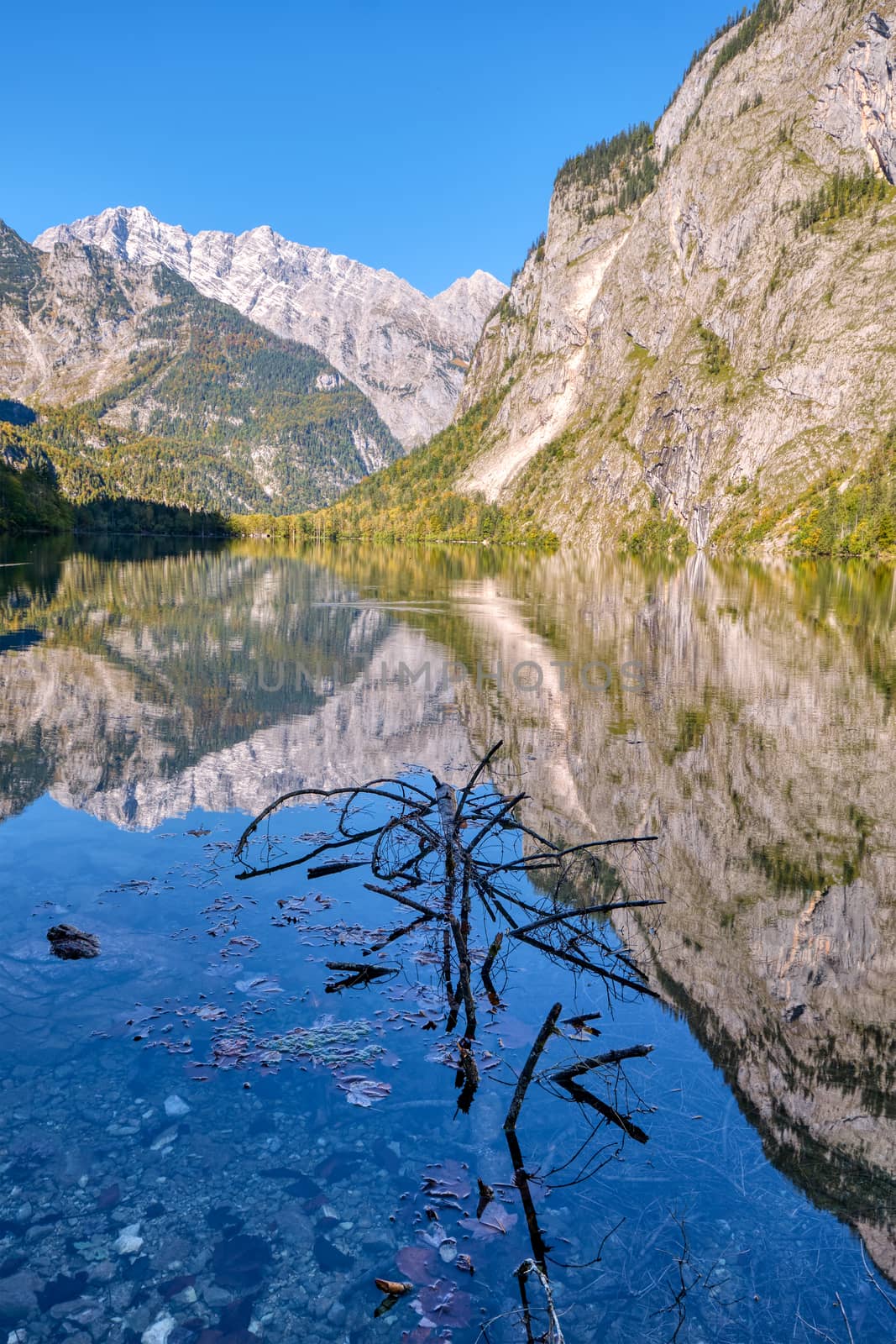 The beautiful Obersee in the Bavarian Alps with a reflection of the mountains in the water