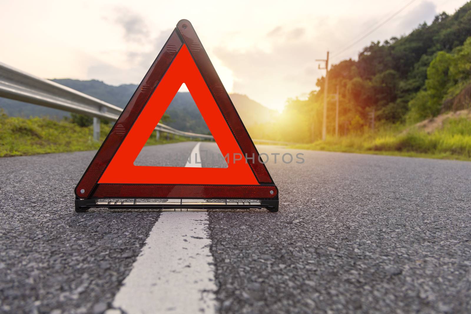 Red triangle, red emergency stop sign, red emergency symbol on road. 