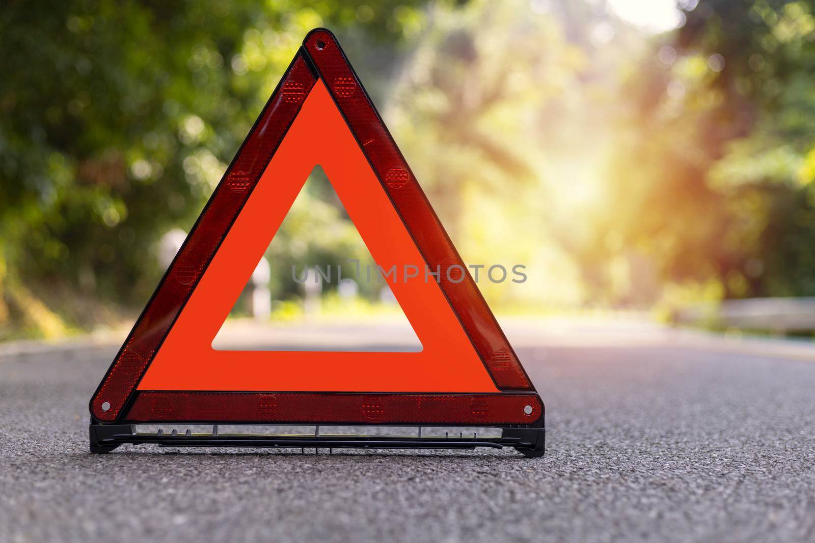 Red triangle, red emergency stop sign, red emergency symbol on road.