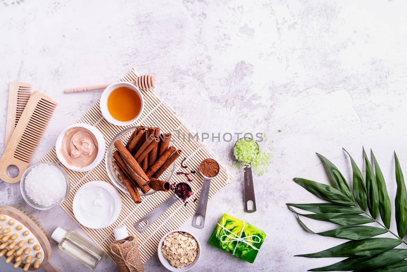 Natural cosmetics concepts. Beautiful spa setting with palm leaf top view flat lay