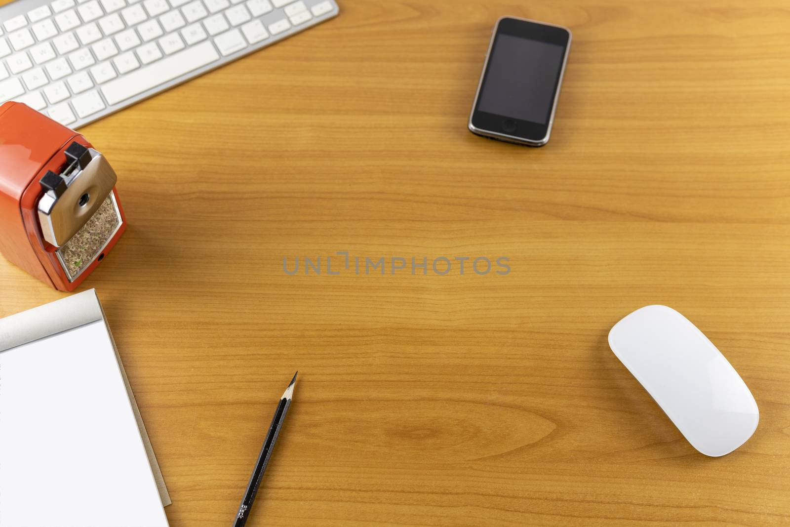 Top view office desk with mouse, laptop, keyboard, bill book and pencil on wood table . With copy space for text or design.