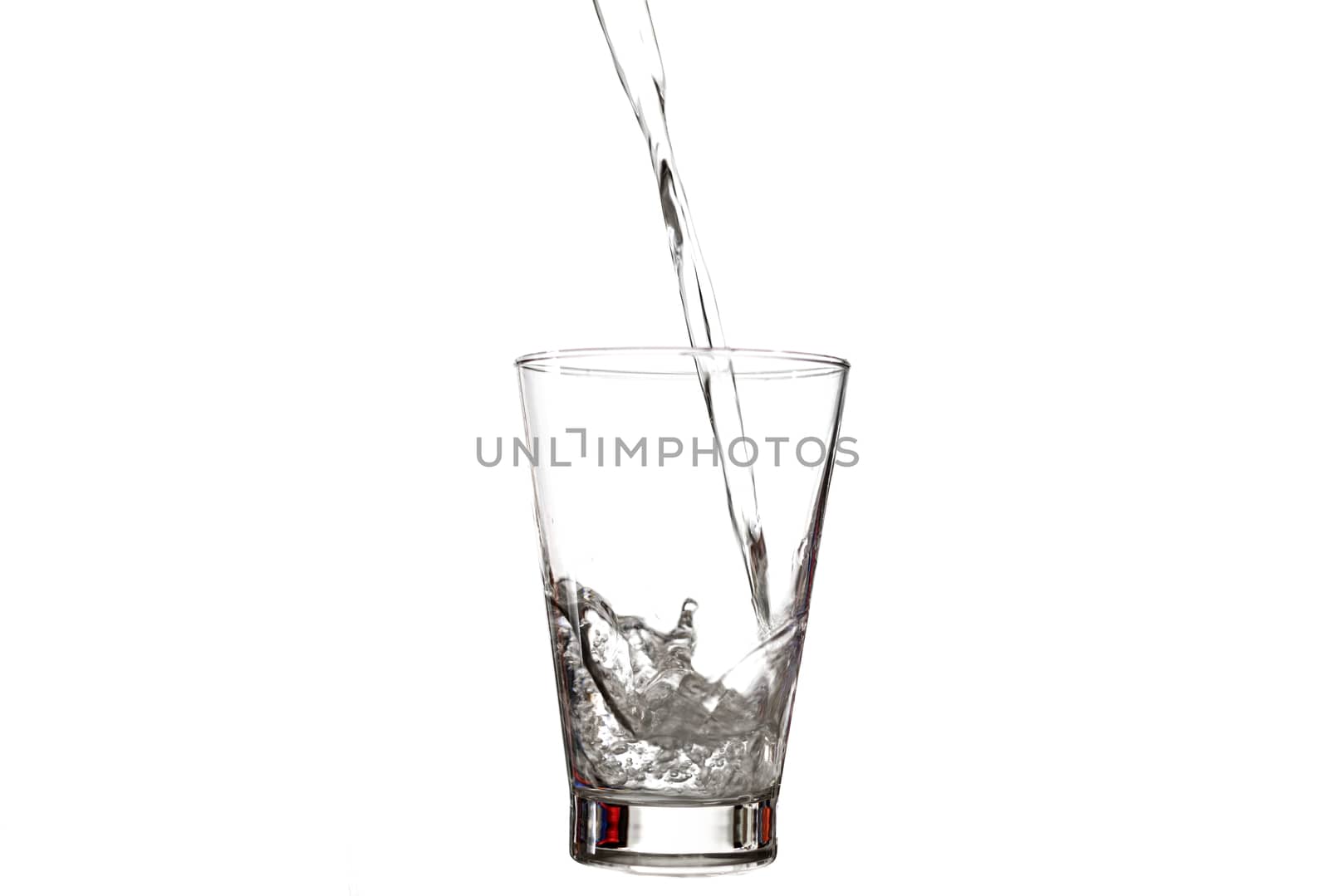 water splashing to glass isolated on white background