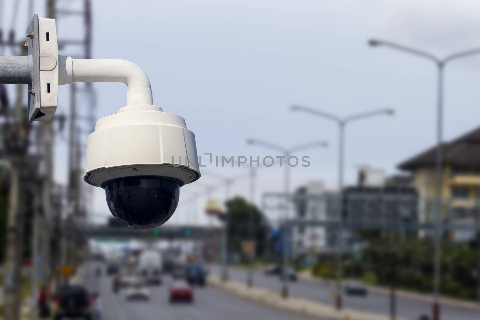 Dome cctv camera outdoor on traffic road