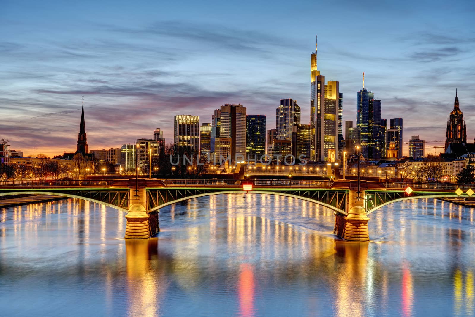 Dramatic sunset over downtown Frankfurt and the river Main