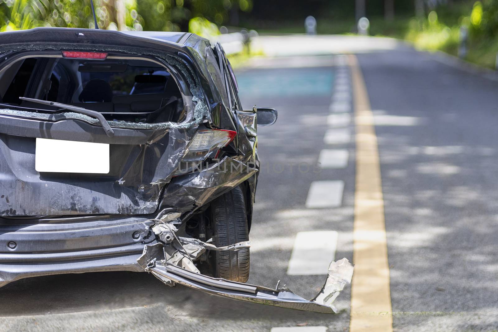 Back side of black color car big damaged and broken by accident on road parking can not drive any more. With copy space for text or design