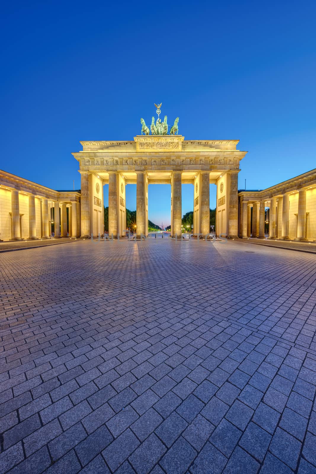The illuminated Brandenburg Gate in Berlin by elxeneize