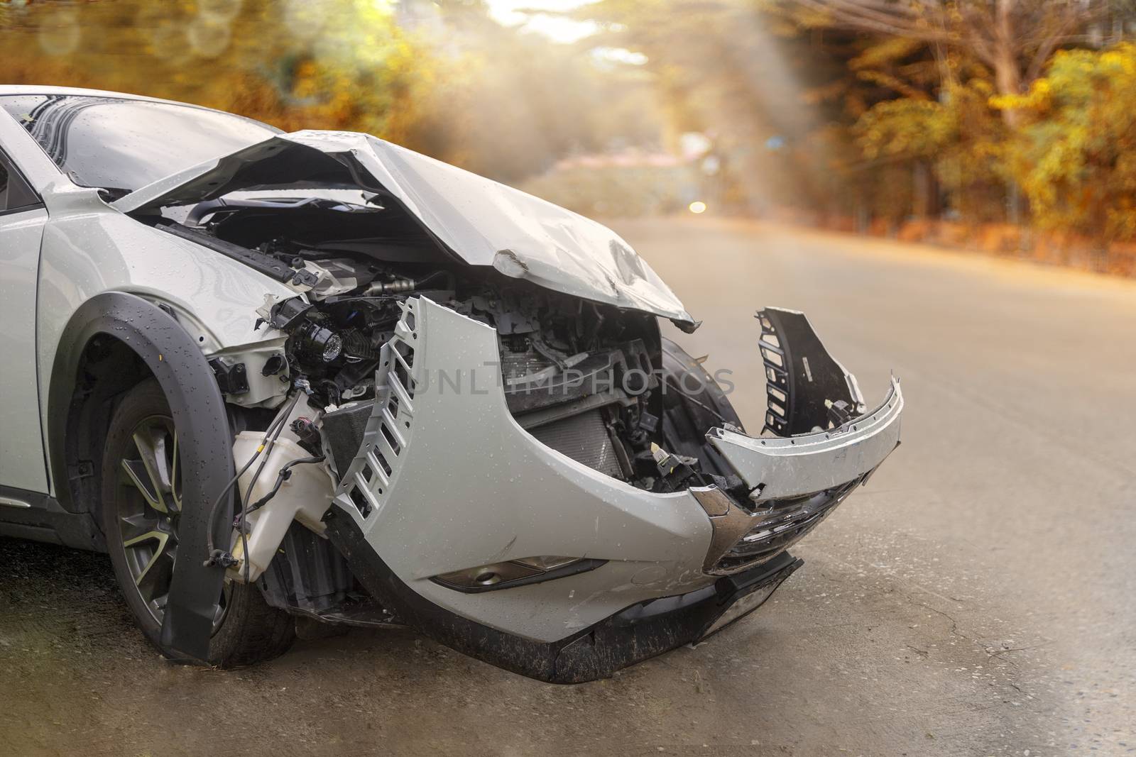 Front of  gray color car have damaged and broken by accident on road parking can not dirve any more. With copy space for text or design