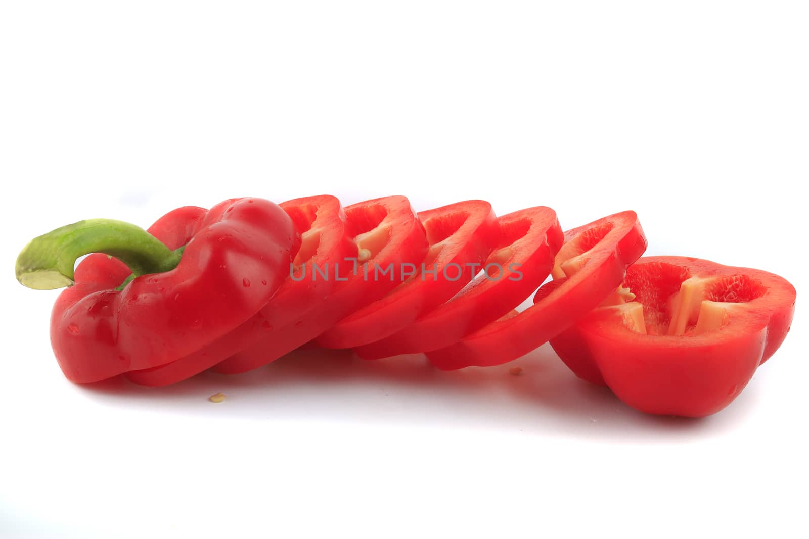 Slide fresh red bell pepper. Sweet pepper. Giant pepper. Isolate on white background. Save with clipping path.