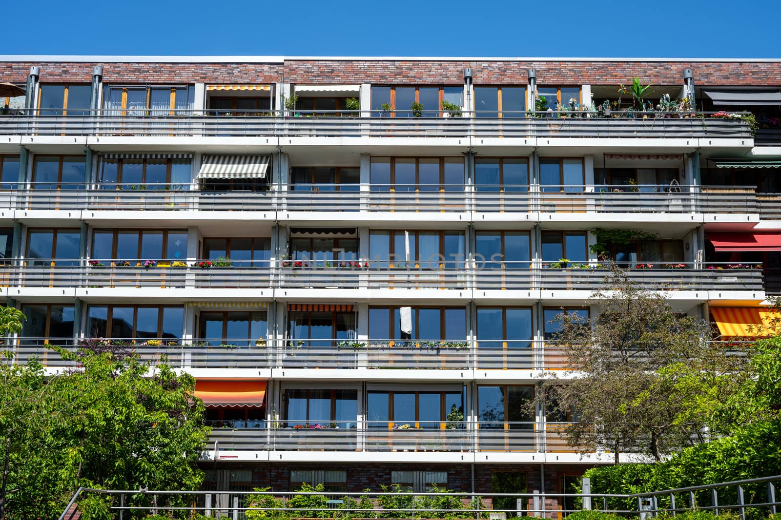 Facade of a modern apartment block with many balconies seen in Berlin