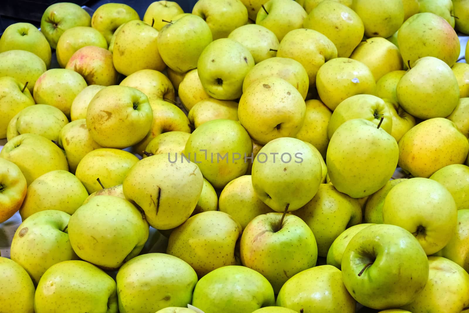 Green apples for sale at a market
