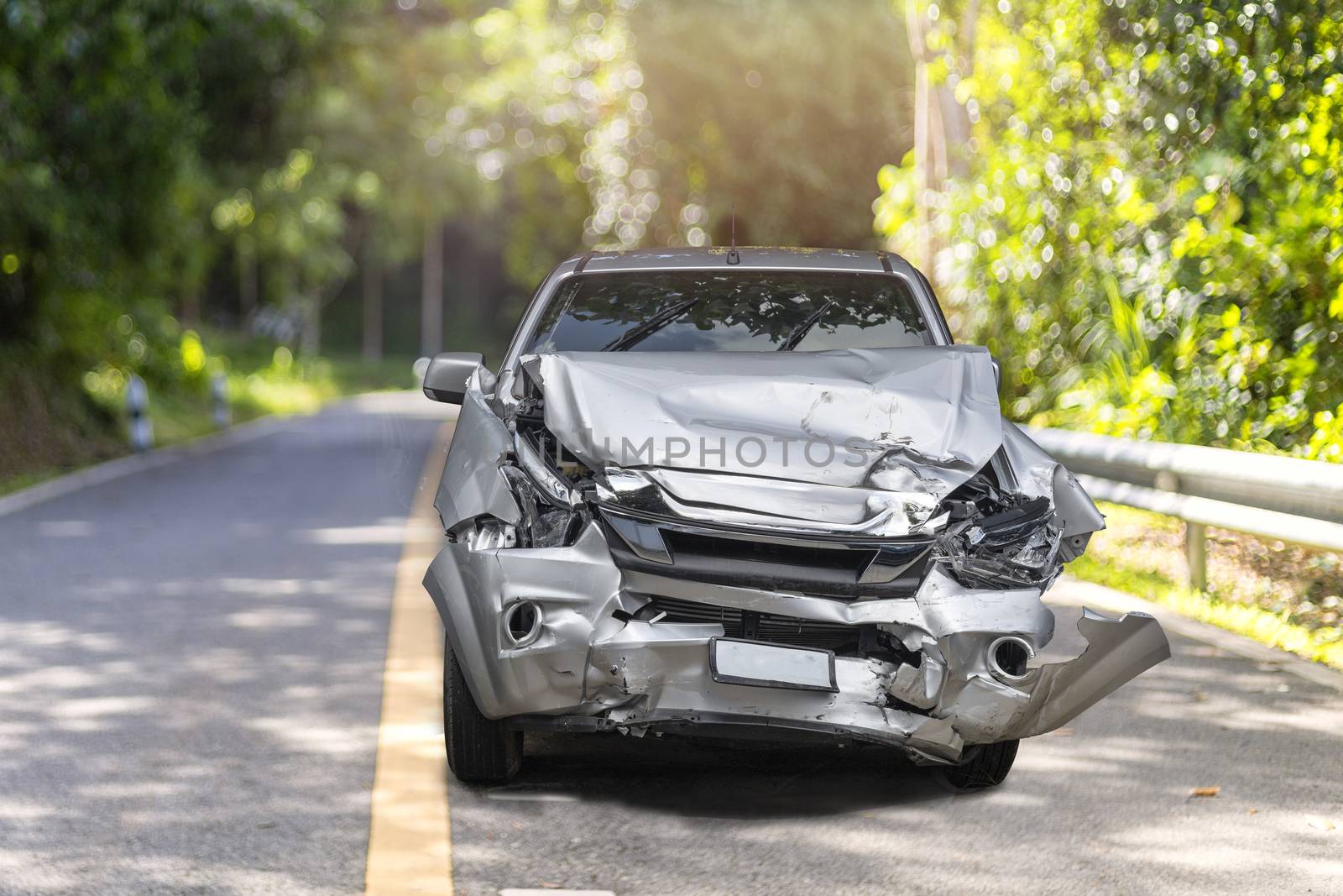 Front of gray color car big damaged and broken by accident on road parking can not drive any more. With copy space for text or design