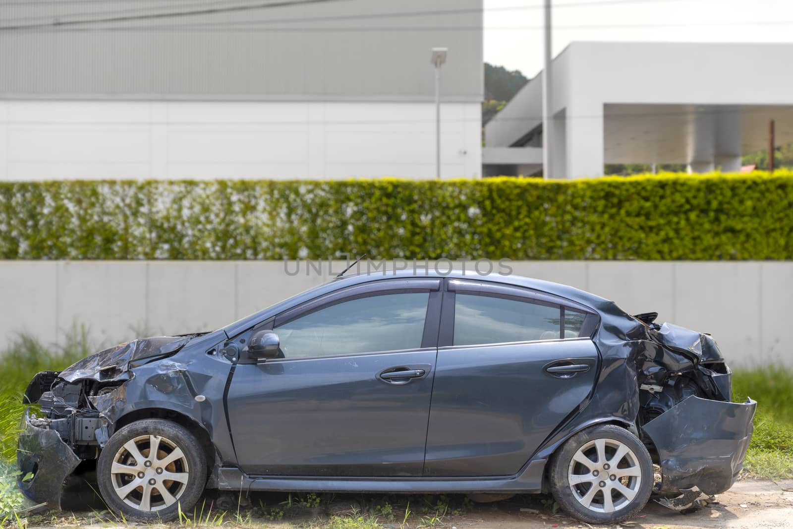 Gray color car damaged and broken by accident on road parking can not dirve any more