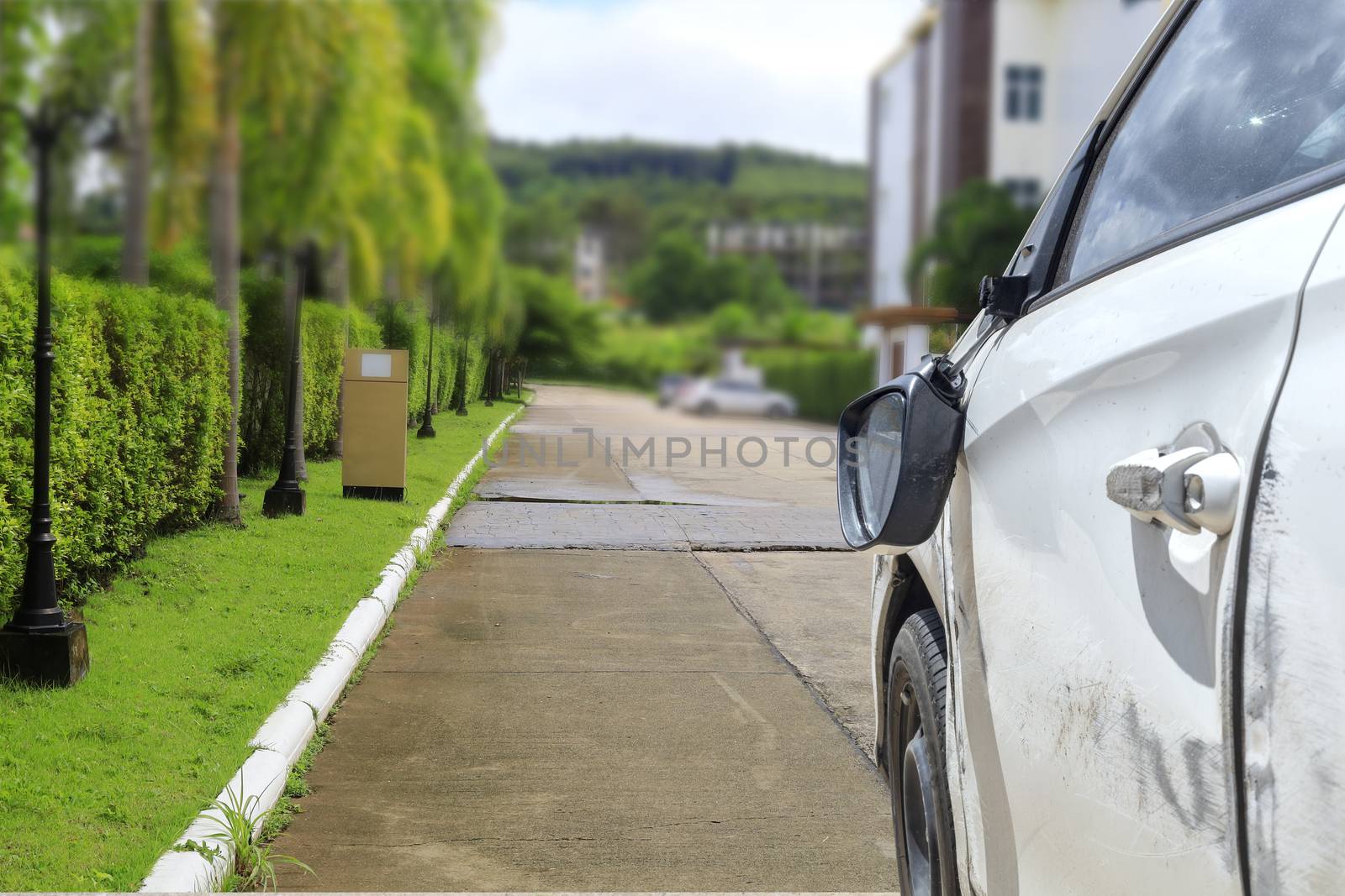 Car accident on road car door and rearview mirror  broken.