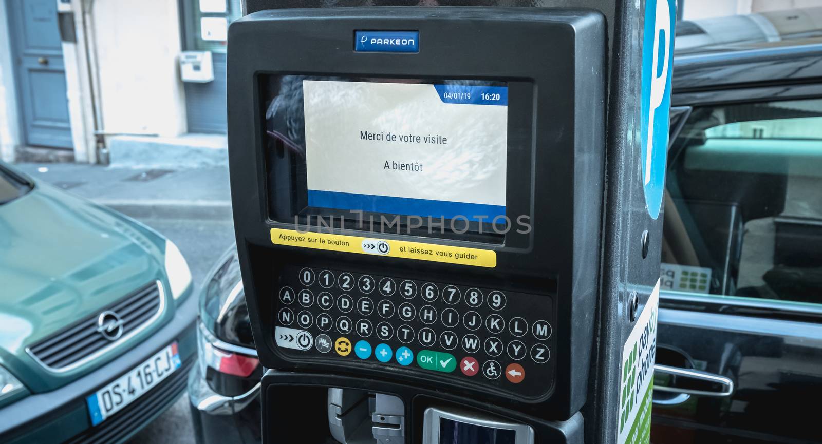 Sete, France - January 4, 2019: Thank you for your visit, see you soon in French on a parking ticket machine on a winter day
