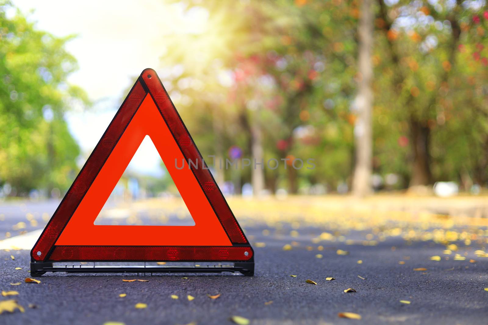Red triangle, red emergency stop sign, red emergency symbol on road. With copy space for text or design