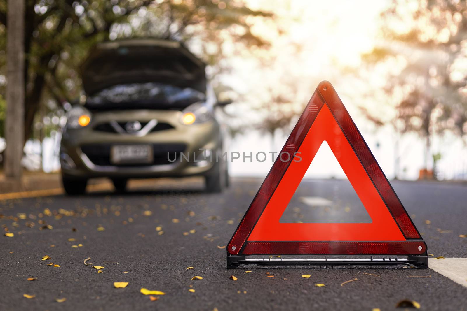 Red triangle, red emergency stop sign, red emergency symbol and  car stop and park on road.
