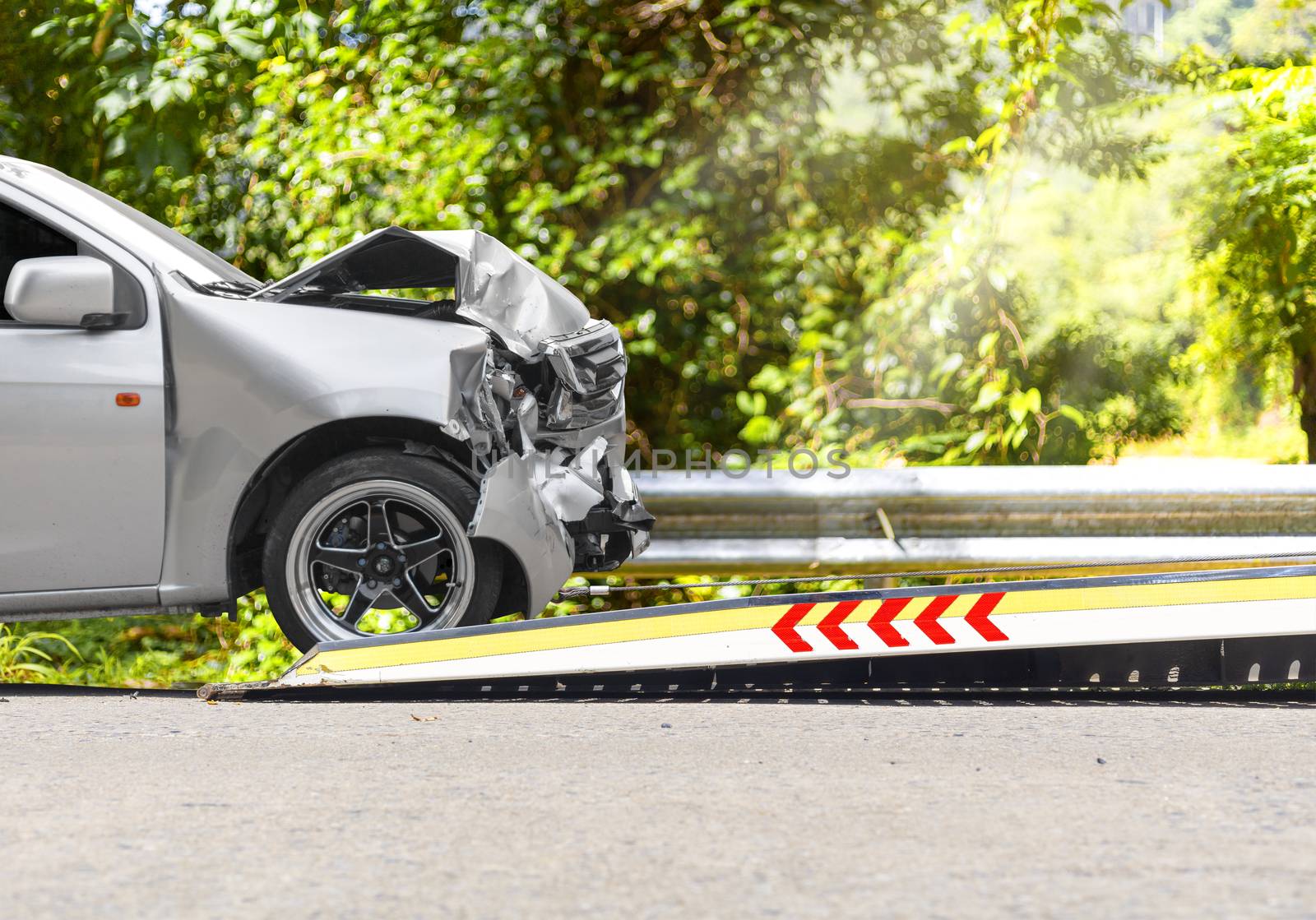 accident Car Slide on  truck for move. Gray car have damage by accident on road take with slide truck move . Isolate on white background.
