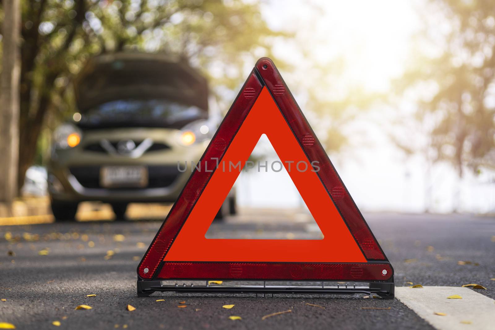 Red triangle, red emergency stop sign, red emergency symbol and  car stop and park on road.