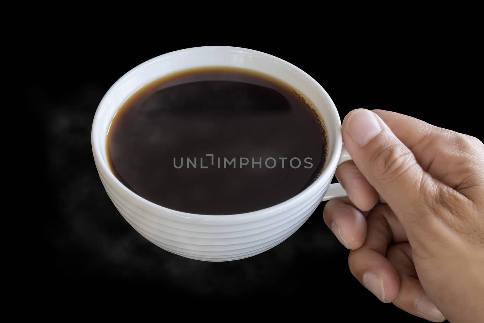Top view hand man hold the white coffee cup wiht hot black coffe by Satrinekarn