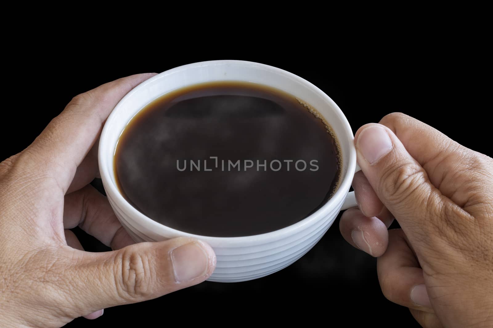 Two hand man hold the white coffee cup wiht hot black coffee in  by Satrinekarn