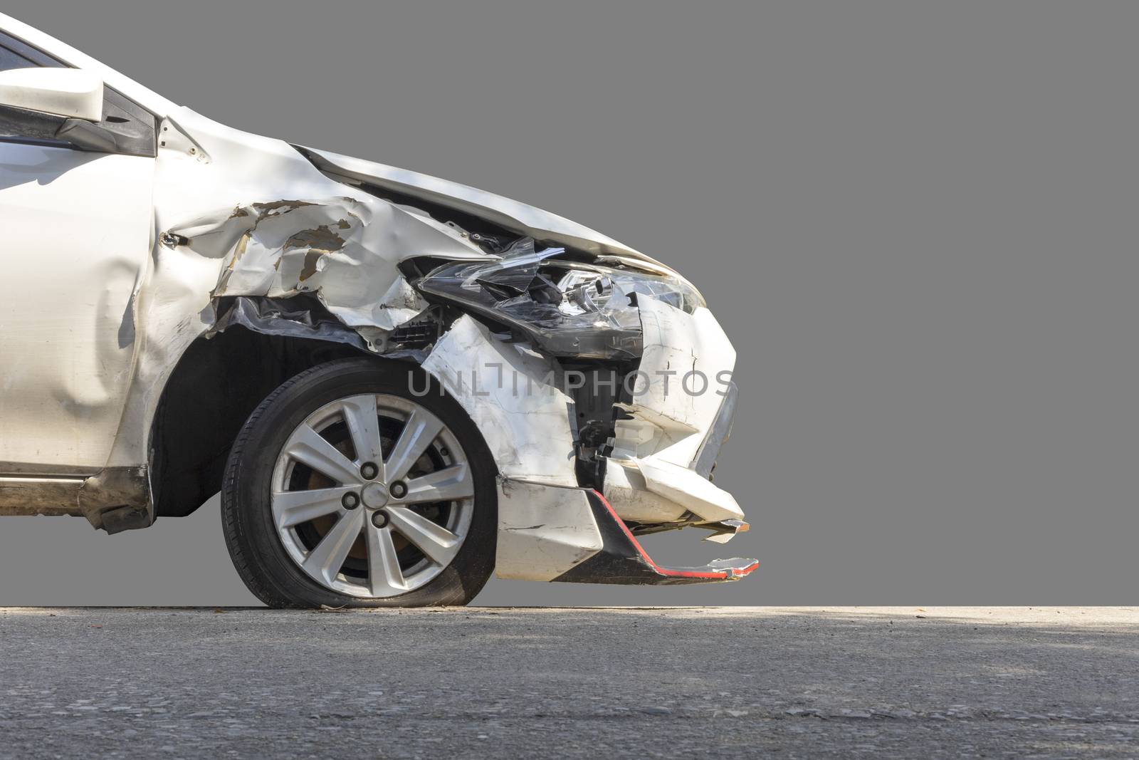 Front of white color car damaged and broken by accident isolated on white background. Save with clipping path. 