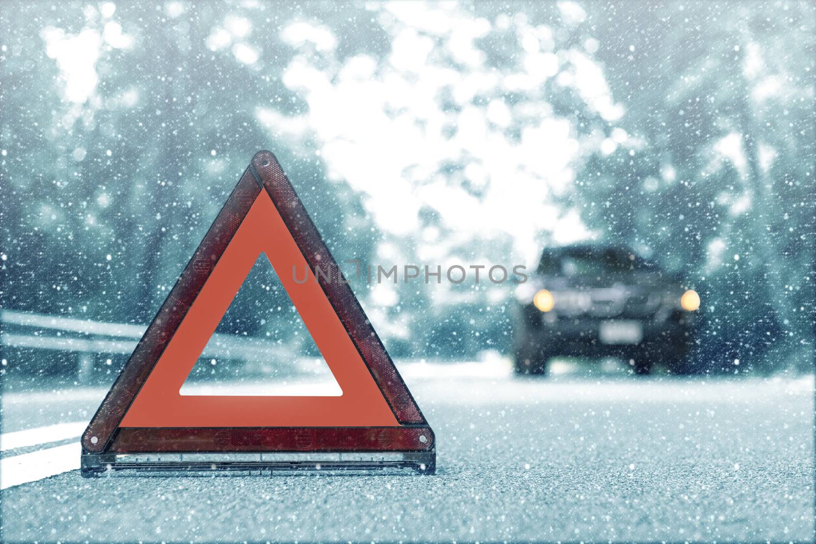 Snow time black car have accident park on road. Red triangle, red emergency stop sign, red emergency symbol and black car stop and park on road.