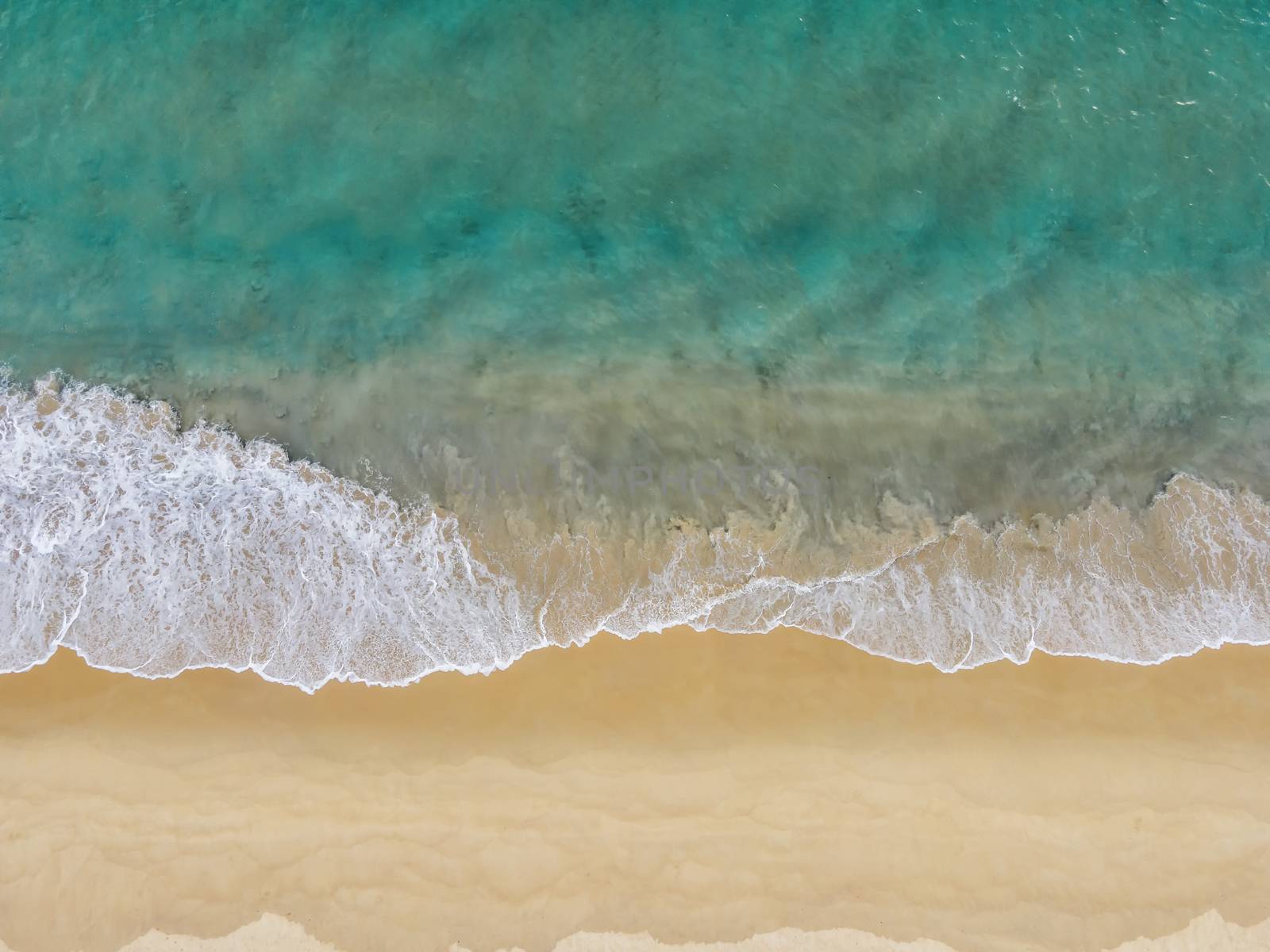 Aerial Drone view beautiful empty beach. Top view wave from sea  by Satrinekarn