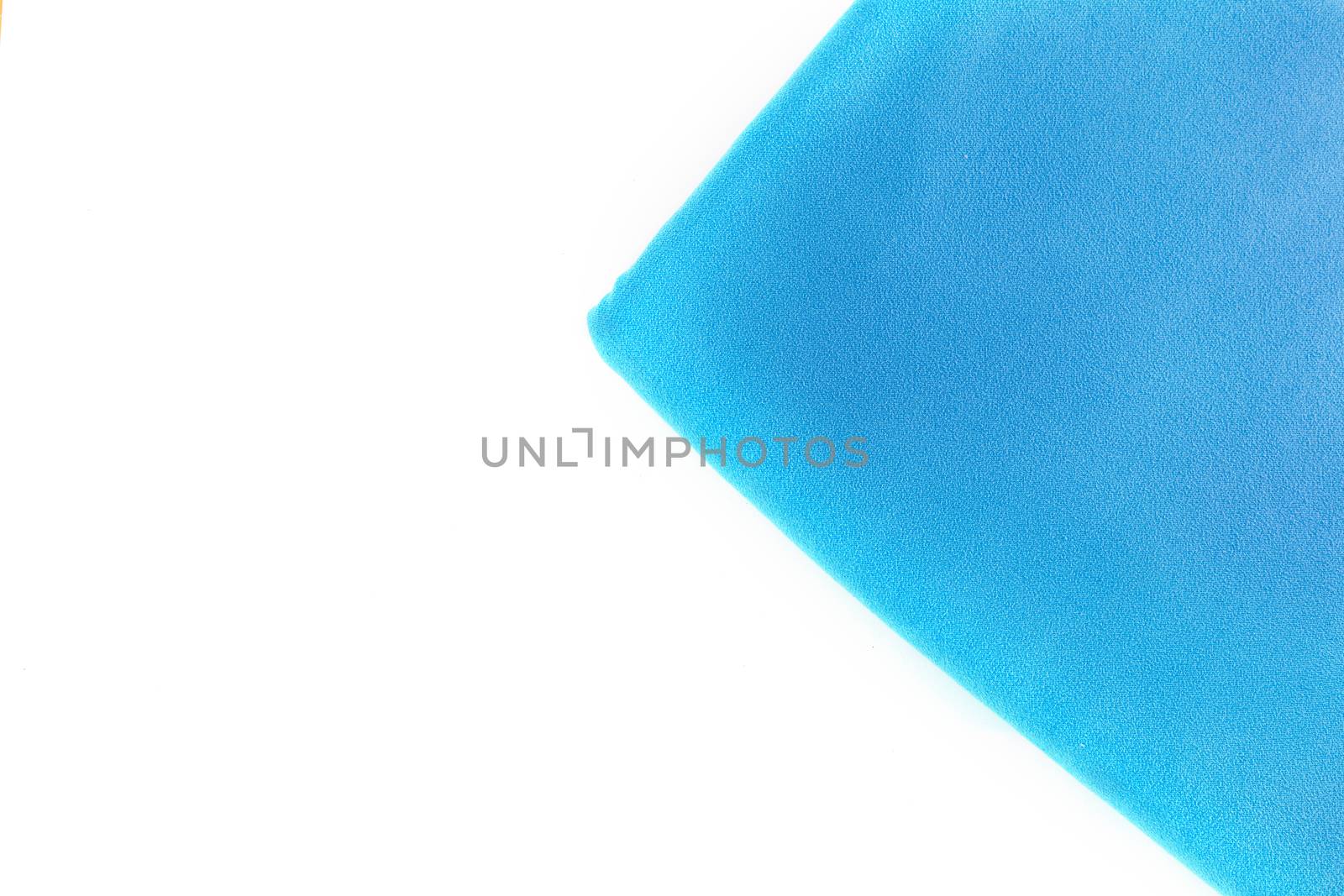 Top view Close up coner of  towel blue color on white background with copy space.
