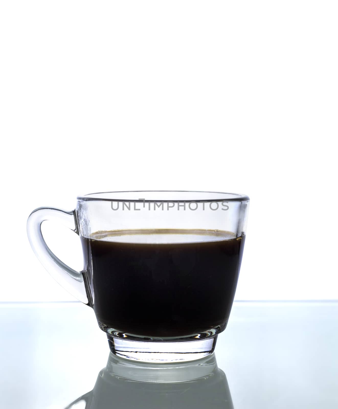 Black coffee in glass on white background.