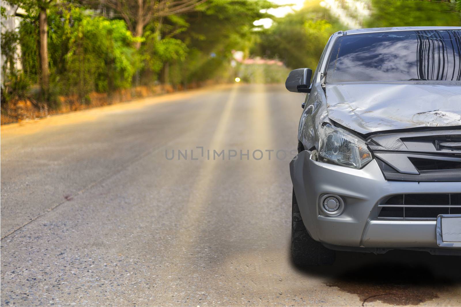 Front of light gray color car with pick up have big damaged and broken by accident on road in morning time can not drive any more park for wait insurance officer. With copy space for text or design