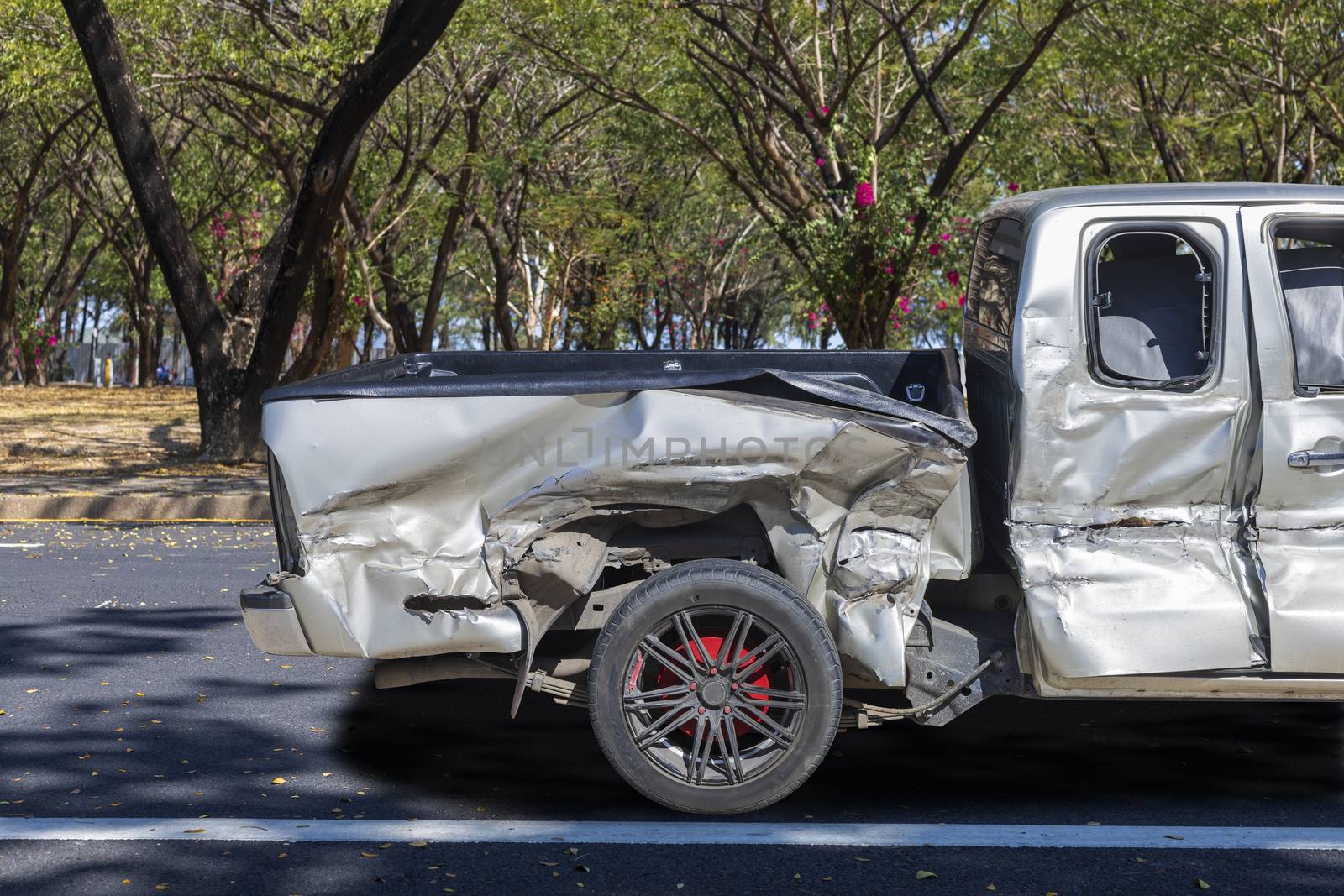 Back of gray color car big damaged and broken by accident on city street parking can not drive any more. With copy space for text or design