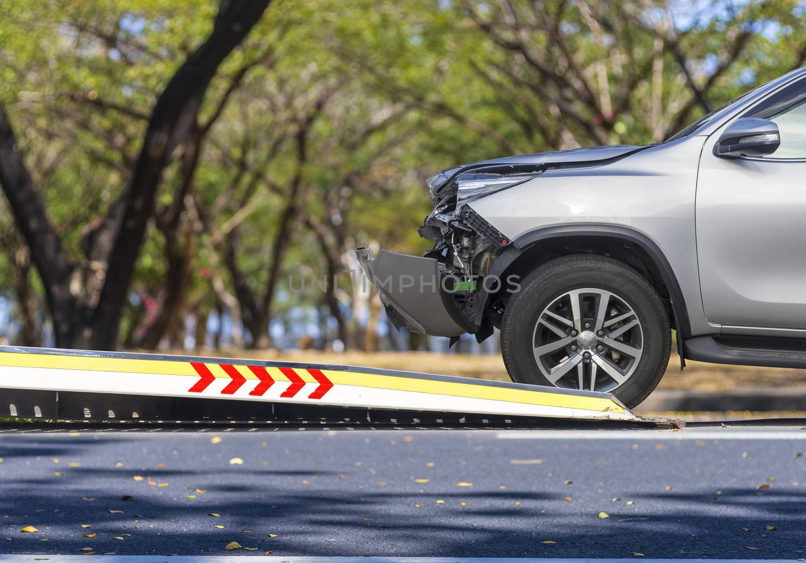 accident Car Slide on  truck for move. Gray car have damage by accident on road take with slide truck move . Isolate on white background.