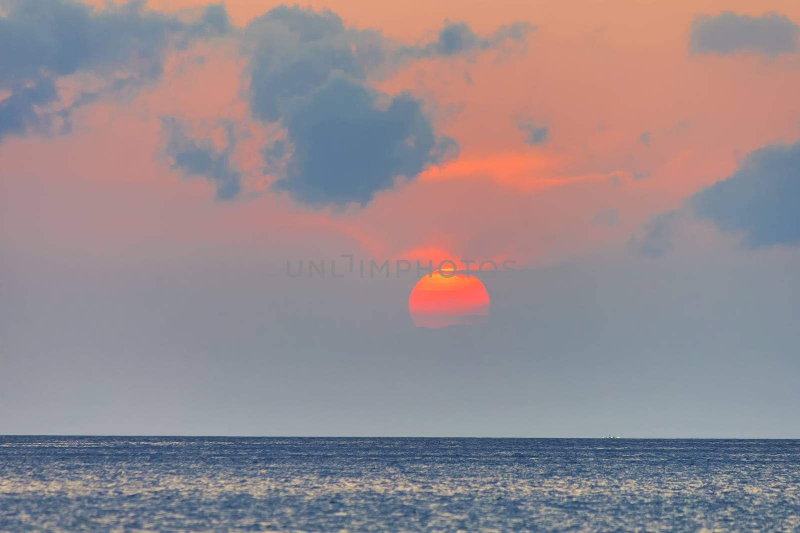 Closeup red sunset and red sky over the sea . With copy space for text or design.